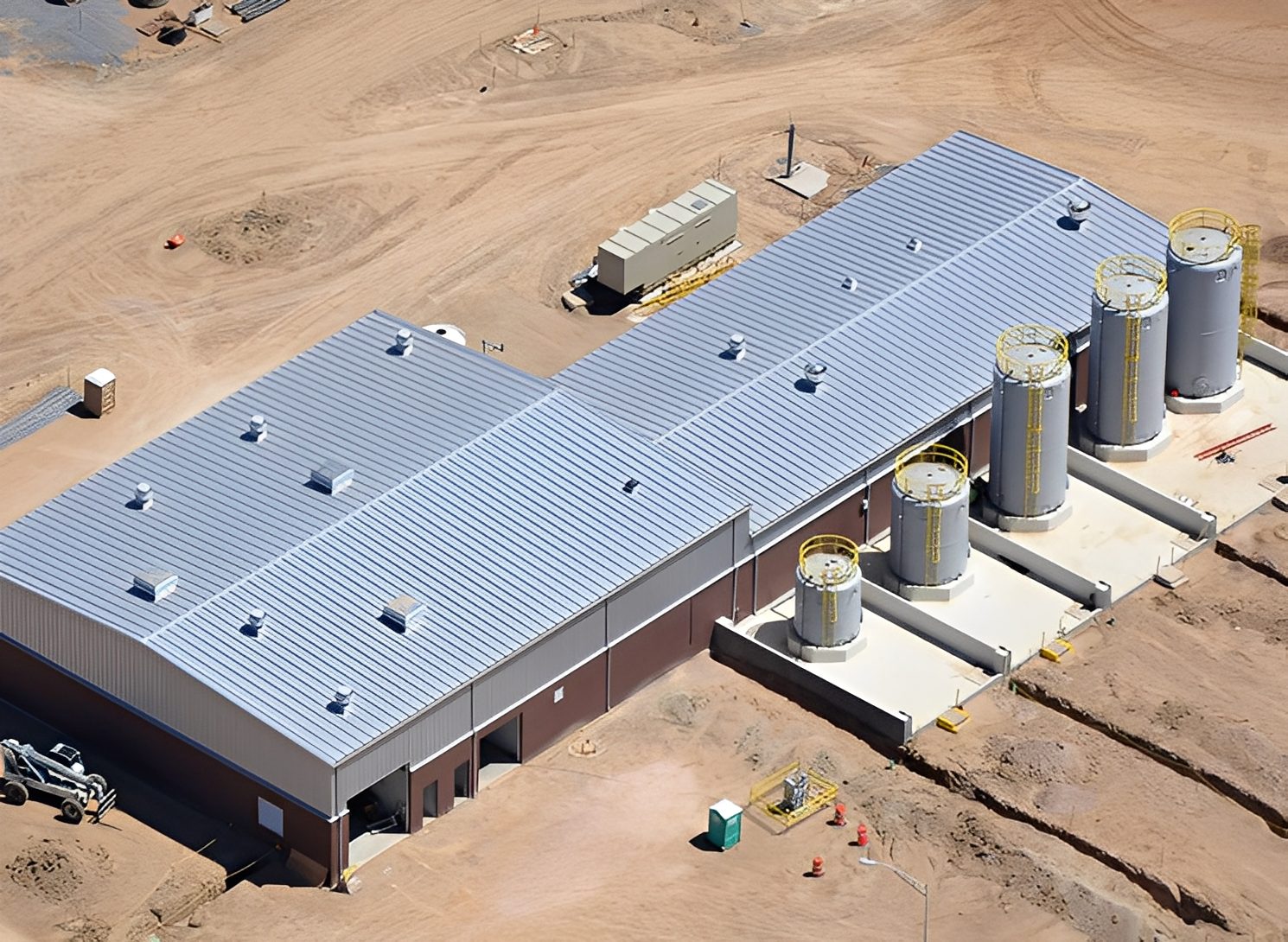 Industrial building with large storage tanks.