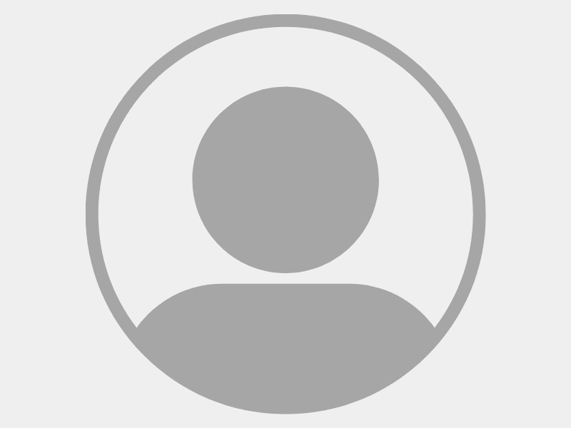 Default profile avatar silhouette in gray.